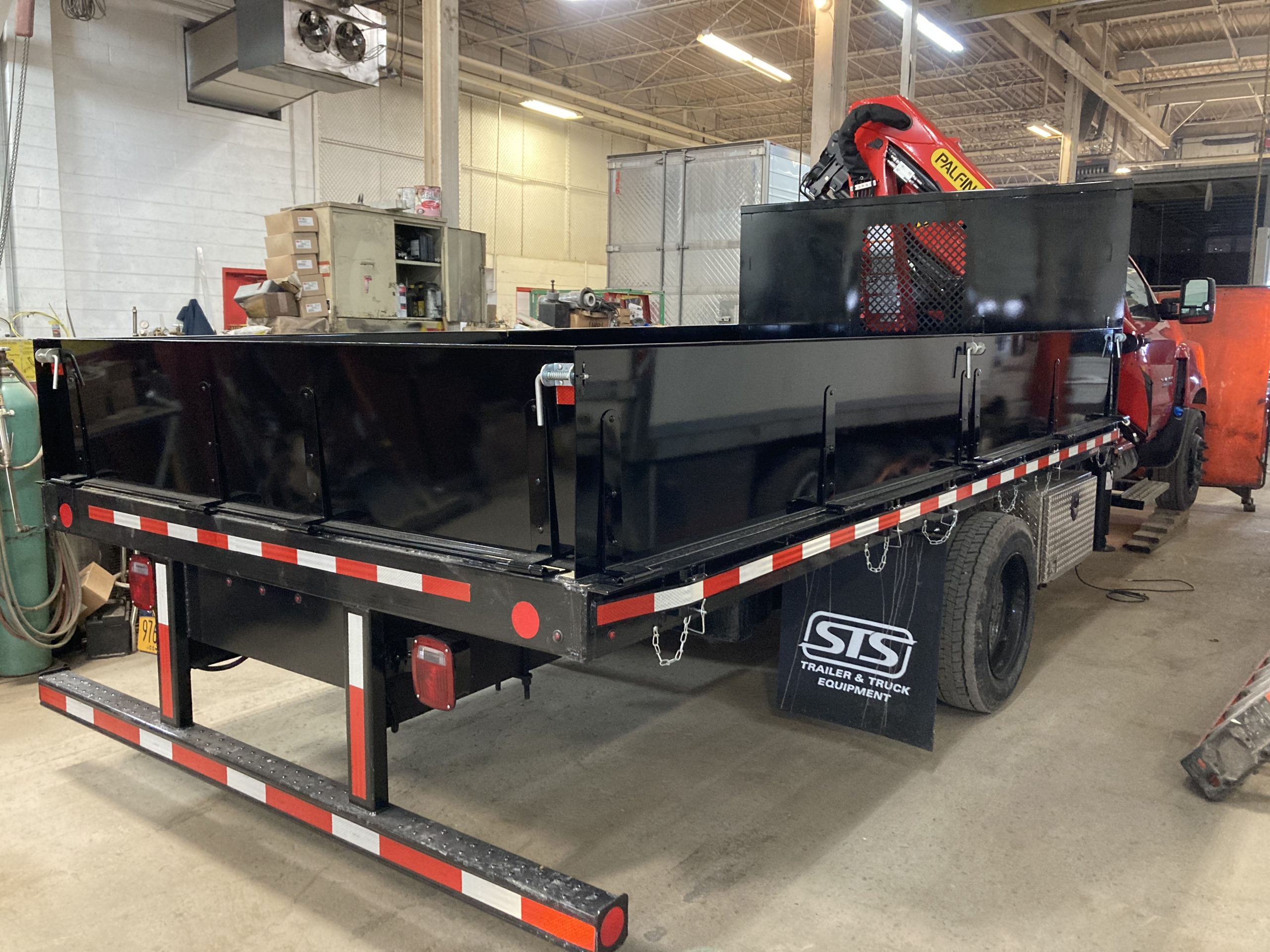 It’s a Morgan flatbed with a Palfinger crane and we built those sides.